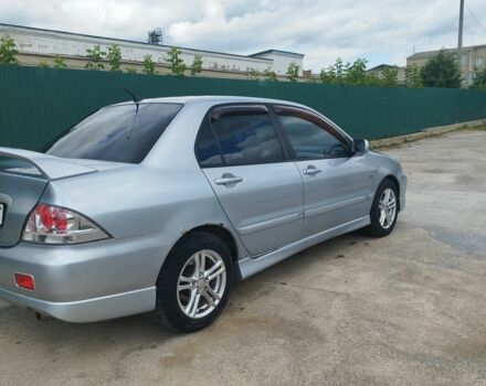 Серый Мицубиси Лансер, объемом двигателя 2 л и пробегом 306 тыс. км за 4100 $, фото 5 на Automoto.ua