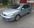 Сірий Міцубісі Lancer, об'ємом двигуна 1.6 л та пробігом 249 тис. км за 4600 $, фото 1 на Automoto.ua