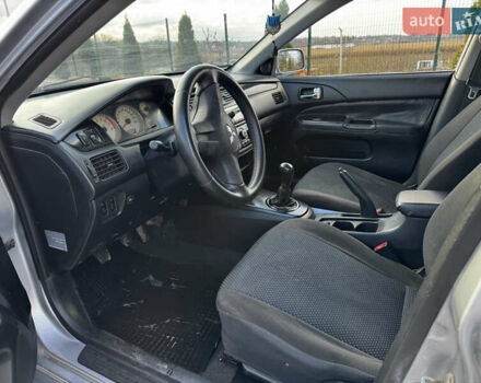 Сірий Міцубісі Lancer, об'ємом двигуна 1.58 л та пробігом 333 тис. км за 2700 $, фото 9 на Automoto.ua