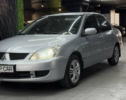 Серый Мицубиси Лансер, объемом двигателя 1.58 л и пробегом 271 тыс. км за 4200 $, фото 7 на Automoto.ua