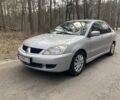 Сірий Міцубісі Lancer, об'ємом двигуна 1.6 л та пробігом 247 тис. км за 5400 $, фото 1 на Automoto.ua