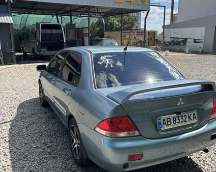 Сірий Міцубісі Lancer, об'ємом двигуна 1.58 л та пробігом 180 тис. км за 4400 $, фото 3 на Automoto.ua