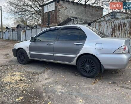 Сірий Міцубісі Lancer, об'ємом двигуна 1.58 л та пробігом 305 тис. км за 3300 $, фото 2 на Automoto.ua