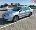 Сірий Міцубісі Lancer, об'ємом двигуна 1.58 л та пробігом 250 тис. км за 3000 $, фото 1 на Automoto.ua