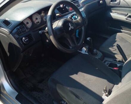 Серый Мицубиси Лансер, объемом двигателя 1.6 л и пробегом 210 тыс. км за 3500 $, фото 4 на Automoto.ua