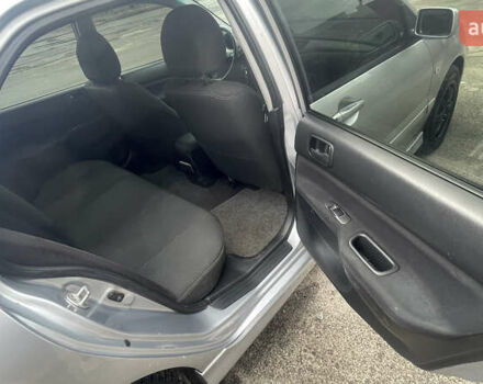 Серый Мицубиси Лансер, объемом двигателя 2 л и пробегом 230 тыс. км за 4000 $, фото 3 на Automoto.ua