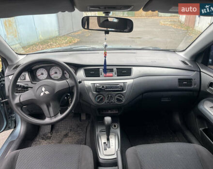 Серый Мицубиси Лансер, объемом двигателя 1.58 л и пробегом 205 тыс. км за 4750 $, фото 8 на Automoto.ua