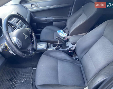 Серый Мицубиси Лансер, объемом двигателя 2 л и пробегом 215 тыс. км за 5750 $, фото 5 на Automoto.ua