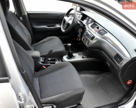 Серый Мицубиси Лансер, объемом двигателя 1.58 л и пробегом 199 тыс. км за 3400 $, фото 24 на Automoto.ua