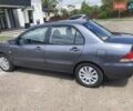 Сірий Міцубісі Lancer, об'ємом двигуна 1.59 л та пробігом 44 тис. км за 6200 $, фото 1 на Automoto.ua