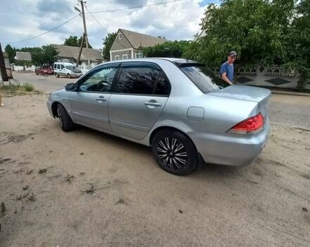 Сірий Міцубісі Lancer, об'ємом двигуна 1.58 л та пробігом 416 тис. км за 3100 $, фото 13 на Automoto.ua