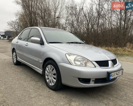 Серый Мицубиси Лансер, объемом двигателя 1.58 л и пробегом 240 тыс. км за 5500 $, фото 1 на Automoto.ua