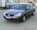 Серый Мицубиси Лансер, объемом двигателя 1.6 л и пробегом 187 тыс. км за 4200 $, фото 1 на Automoto.ua