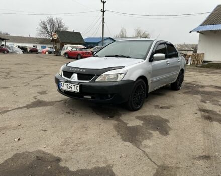 Серый Мицубиси Лансер, объемом двигателя 1.6 л и пробегом 298 тыс. км за 3600 $, фото 1 на Automoto.ua