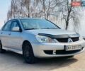 Серый Мицубиси Лансер, объемом двигателя 1.58 л и пробегом 369 тыс. км за 2600 $, фото 1 на Automoto.ua