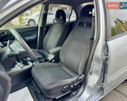 Сірий Міцубісі Lancer, об'ємом двигуна 1.58 л та пробігом 138 тис. км за 4990 $, фото 16 на Automoto.ua