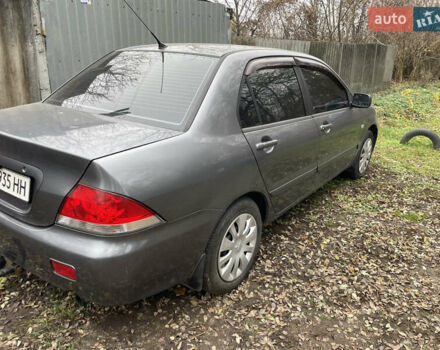 Сірий Міцубісі Lancer, об'ємом двигуна 1.58 л та пробігом 290 тис. км за 3500 $, фото 1 на Automoto.ua