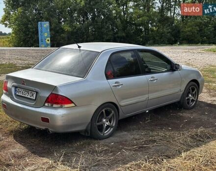 Серый Мицубиси Лансер, объемом двигателя 1.6 л и пробегом 222 тыс. км за 5300 $, фото 7 на Automoto.ua