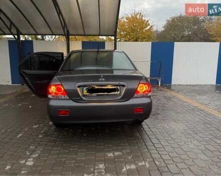 Сірий Міцубісі Lancer, об'ємом двигуна 1.6 л та пробігом 330 тис. км за 3500 $, фото 25 на Automoto.ua