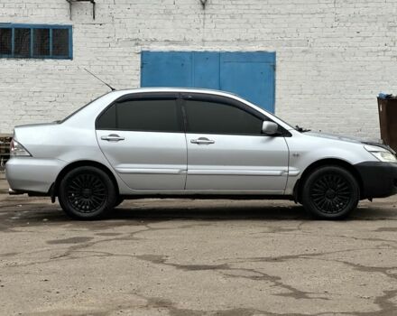 Серый Мицубиси Лансер, объемом двигателя 1.6 л и пробегом 298 тыс. км за 3600 $, фото 3 на Automoto.ua