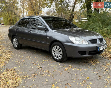 Сірий Міцубісі Lancer, об'ємом двигуна 1.58 л та пробігом 247 тис. км за 4900 $, фото 2 на Automoto.ua