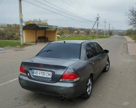 Серый Мицубиси Лансер, объемом двигателя 1.6 л и пробегом 250 тыс. км за 3800 $, фото 1 на Automoto.ua