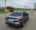 Серый Мицубиси Лансер, объемом двигателя 1.6 л и пробегом 250 тыс. км за 3800 $, фото 1 на Automoto.ua