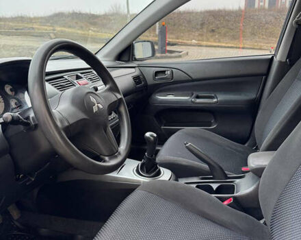 Серый Мицубиси Лансер, объемом двигателя 1.58 л и пробегом 187 тыс. км за 4800 $, фото 4 на Automoto.ua