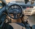 Сірий Міцубісі Lancer, об'ємом двигуна 1.6 л та пробігом 222 тис. км за 3990 $, фото 24 на Automoto.ua