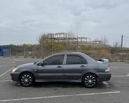 Серый Мицубиси Лансер, объемом двигателя 1.6 л и пробегом 350 тыс. км за 2850 $, фото 4 на Automoto.ua