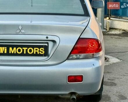 Сірий Міцубісі Lancer, об'ємом двигуна 1.6 л та пробігом 395 тис. км за 4900 $, фото 11 на Automoto.ua