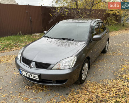 Сірий Міцубісі Lancer, об'ємом двигуна 1.58 л та пробігом 247 тис. км за 4900 $, фото 14 на Automoto.ua