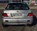 Сірий Міцубісі Lancer, об'ємом двигуна 1.6 л та пробігом 237 тис. км за 4950 $, фото 4 на Automoto.ua