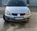 Сірий Міцубісі Lancer, об'ємом двигуна 1.6 л та пробігом 136 тис. км за 4550 $, фото 11 на Automoto.ua