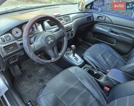 Сірий Міцубісі Lancer, об'ємом двигуна 1.58 л та пробігом 235 тис. км за 5200 $, фото 10 на Automoto.ua