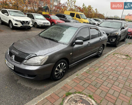 Серый Мицубиси Лансер, объемом двигателя 1.6 л и пробегом 115 тыс. км за 2800 $, фото 1 на Automoto.ua