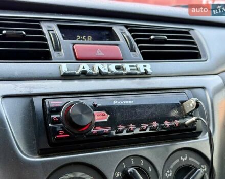 Сірий Міцубісі Lancer, об'ємом двигуна 1.6 л та пробігом 395 тис. км за 4900 $, фото 16 на Automoto.ua