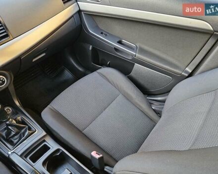 Серый Мицубиси Лансер, объемом двигателя 2 л и пробегом 282 тыс. км за 5450 $, фото 59 на Automoto.ua