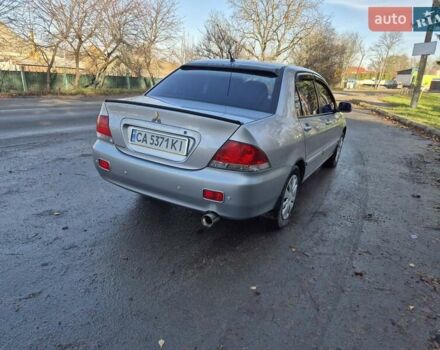 Сірий Міцубісі Lancer, об'ємом двигуна 1.58 л та пробігом 235 тис. км за 5200 $, фото 4 на Automoto.ua