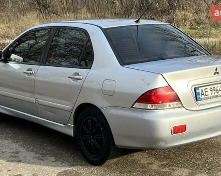 Серый Мицубиси Лансер, объемом двигателя 1.58 л и пробегом 290 тыс. км за 3750 $, фото 1 на Automoto.ua