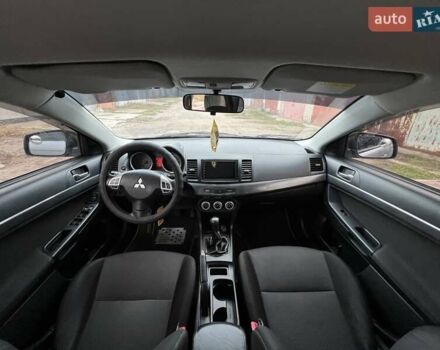 Серый Мицубиси Лансер, объемом двигателя 2 л и пробегом 180 тыс. км за 6799 $, фото 6 на Automoto.ua