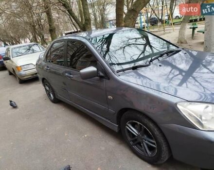 Сірий Міцубісі Lancer, об'ємом двигуна 1.58 л та пробігом 250 тис. км за 4750 $, фото 2 на Automoto.ua