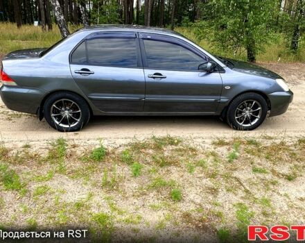 Серый Мицубиси Лансер, объемом двигателя 1.6 л и пробегом 212 тыс. км за 4600 $, фото 3 на Automoto.ua