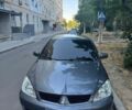 Серый Мицубиси Лансер, объемом двигателя 1.58 л и пробегом 250 тыс. км за 4500 $, фото 1 на Automoto.ua