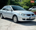 Сірий Міцубісі Lancer, об'ємом двигуна 1.6 л та пробігом 260 тис. км за 4600 $, фото 1 на Automoto.ua