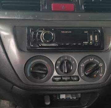 Серый Мицубиси Лансер, объемом двигателя 1.58 л и пробегом 400 тыс. км за 5000 $, фото 12 на Automoto.ua