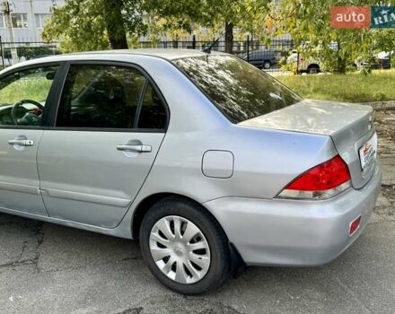 Сірий Міцубісі Lancer, об'ємом двигуна 1.58 л та пробігом 138 тис. км за 4990 $, фото 9 на Automoto.ua