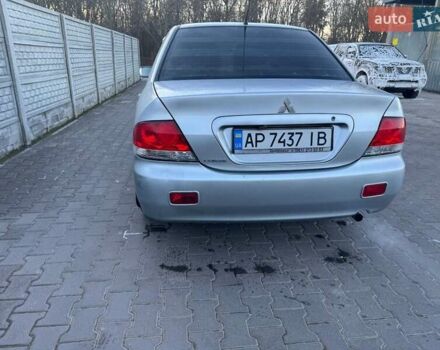 Серый Мицубиси Лансер, объемом двигателя 1.6 л и пробегом 256 тыс. км за 4500 $, фото 1 на Automoto.ua