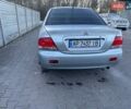 Серый Мицубиси Лансер, объемом двигателя 1.6 л и пробегом 256 тыс. км за 4500 $, фото 1 на Automoto.ua