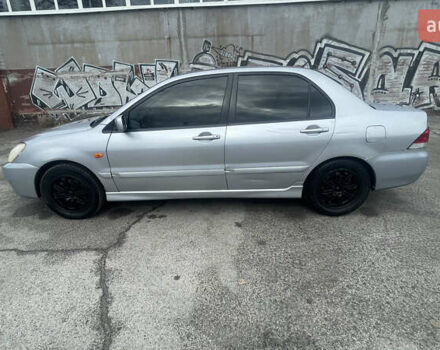 Серый Мицубиси Лансер, объемом двигателя 2 л и пробегом 230 тыс. км за 4000 $, фото 5 на Automoto.ua